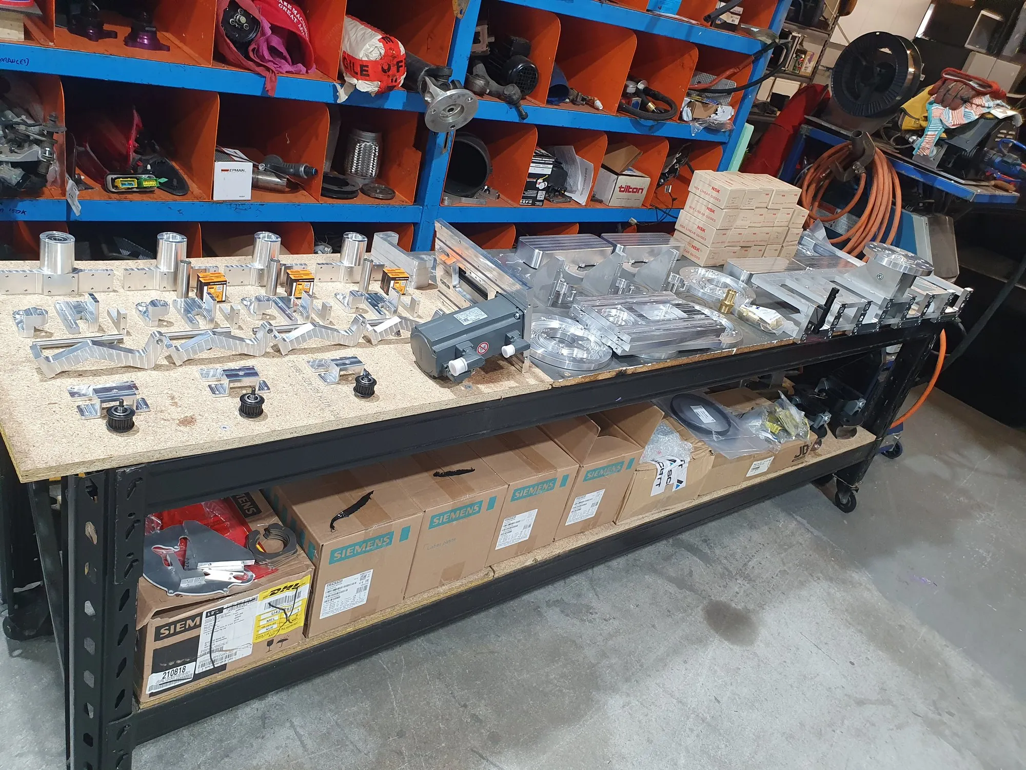 A bench of finished machined parts in the workshop