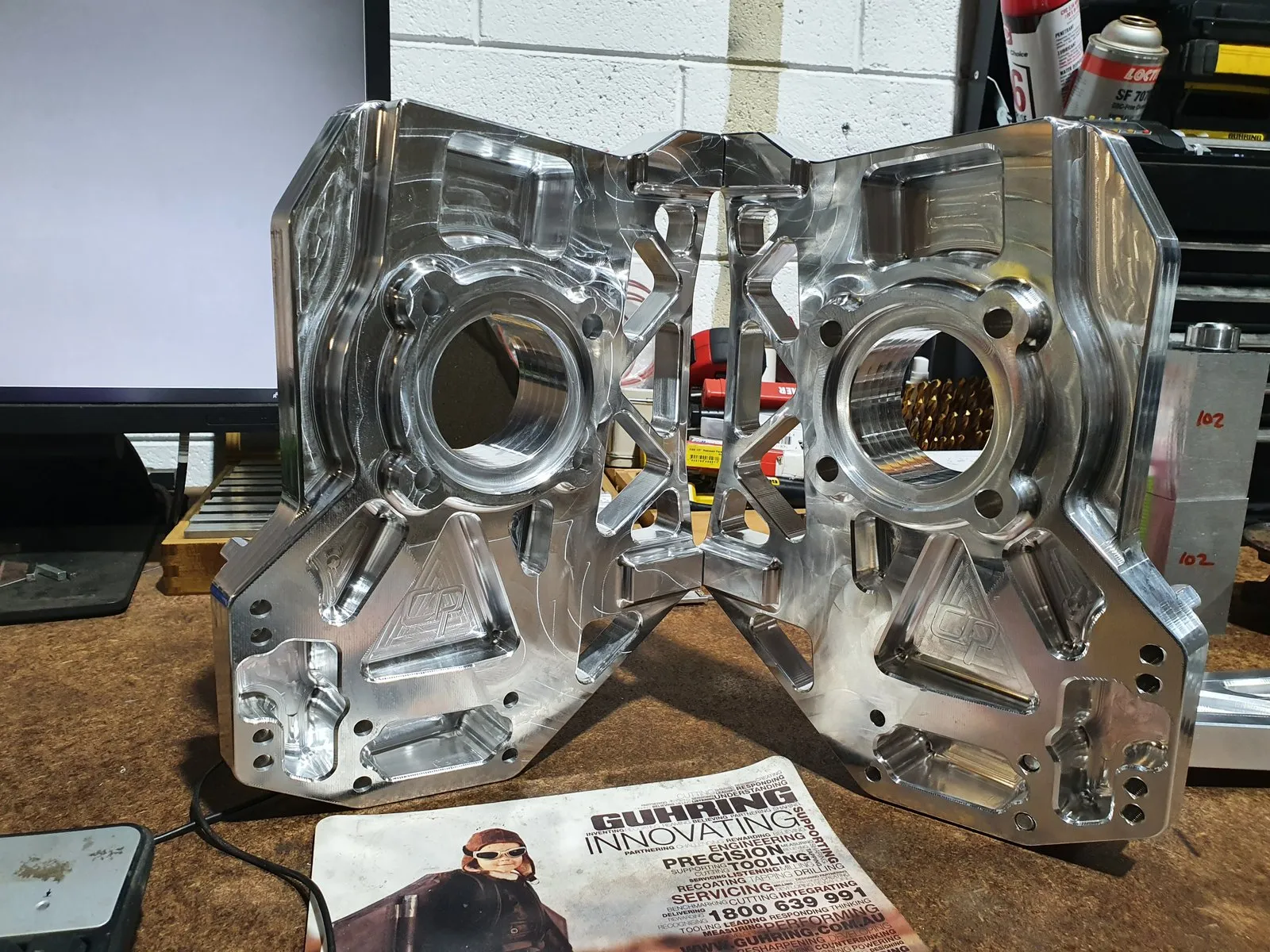 Billet housing: Pocketed for weight, bored on one set-up.